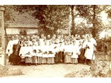 Choir in Rectory garden 1891 with Rev Hughes in the centre.